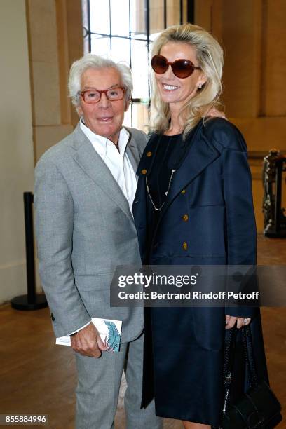 Jean-Daniel Lorieux and his companion Laura Restelli attend the Elie Saab show as part of the Paris Fashion Week Womenswear Spring/Summer 2018 on...