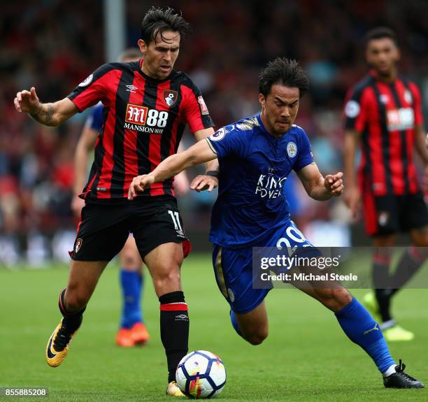 Shinji Okazaki of Leicester City and Charlie Daniels of AFC Bournemouth compete for the ball during the Premier League match between AFC Bournemouth...