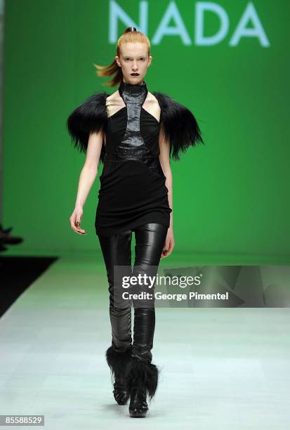 Model walks the runway wearing Nada's 2009 Collection at LG Fashion Week at Nathan Phillips Square on March 19, 2009 in Toronto, Canada.