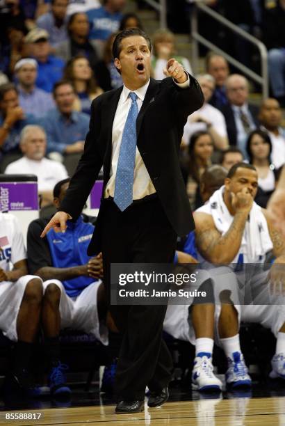 Head Coach John Calipari of the Memphis Tigers points a finger from the sideline during their second round game against the Maryland Terrapins in the...