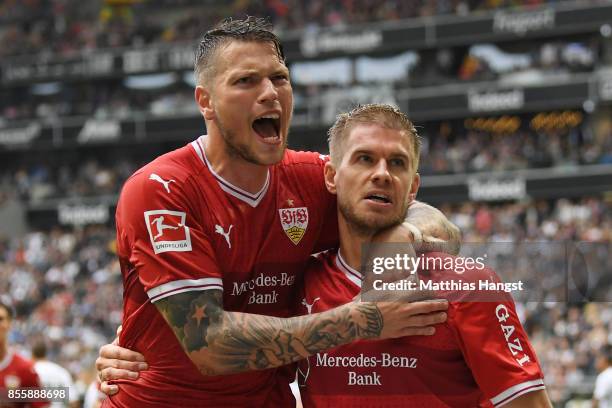 Simon Terodde of Stuttgart celebrates with Daniel Ginczek of Stuttgart after he scored his teams first goal to make it 1:1 during the Bundesliga...