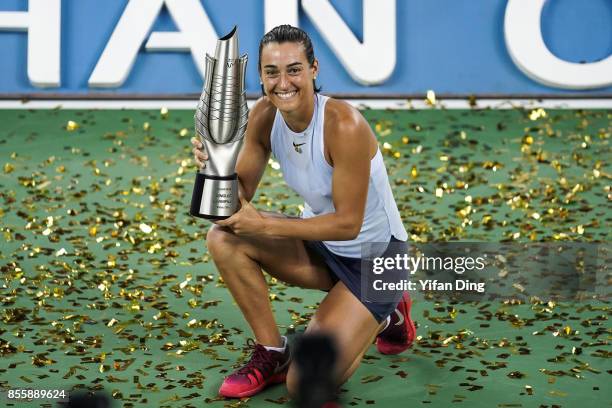 Caroline Garcia poses at the award ceremony after winning the ladies singles final between Ashleigh Barty of Australia and Caroline Garcia of France...