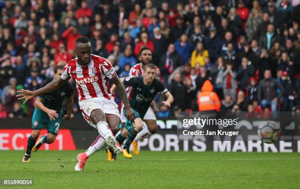 Saido Berahino of Stoke City takes a penalty which is saved by Fraser Forster of Southampton during the Premier League match between Stoke City and...