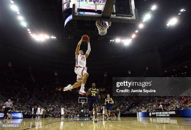 Blake Griffin of the Oklahoma Sooners jumps to the net for a layup against the Michigan Wolverines during the second round of the NCAA Division I...