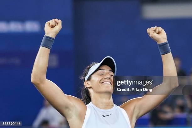 Caroline Garcia reacts after winning the ladies singles final between Ashleigh Barty of Australia and Caroline Garcia of France during Day 7of 2017...