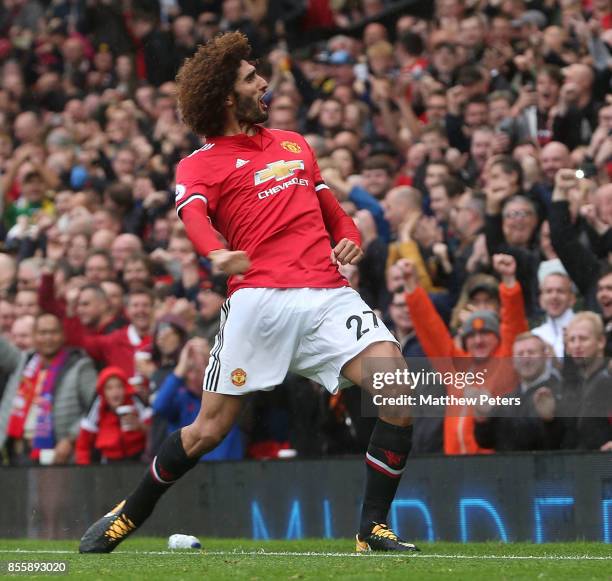 Marouane Fellaini of Manchester United celebrates scoring their third goal during the Premier League match between Manchester United and Crystal...