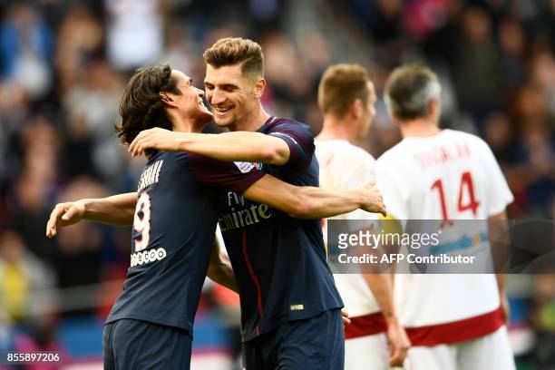 Paris Saint-Germain's Uruguayan forward Edinson Cavani and Paris Saint-Germain's Belgian defender Thomas Meunier celebrate after scoring during the...