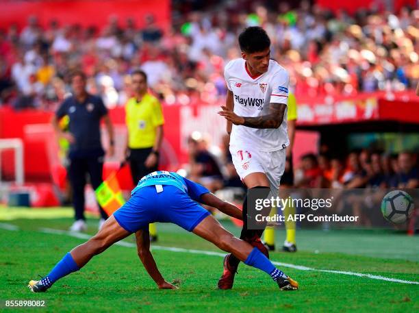 Malaga's Venezuelan defender Roberto Rosales vies with Sevilla's Argentinian midfielder Joaquin Correa during the Spanish league football match...
