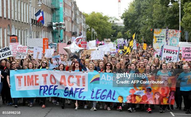 Protesters hold up placards as they take part in the March for Choice, calling for the legalising of abortion in Ireland after the referendum...