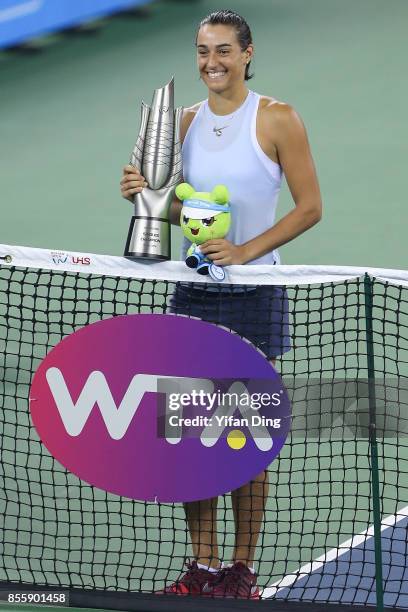 Caroline Garcia kisses the trophy at the award ceremony after winning the ladies singles final between Ashleigh Barty of Australia and Caroline...