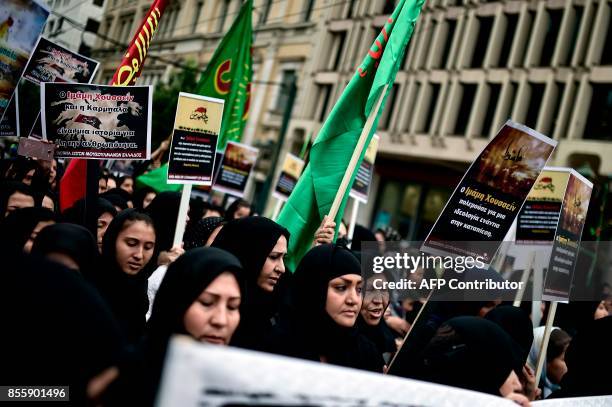 Shiite muslim migrants to Greece take part in a procession in central Athens to mark the Shiite religious holiday of Ashura on September 30, 2017....