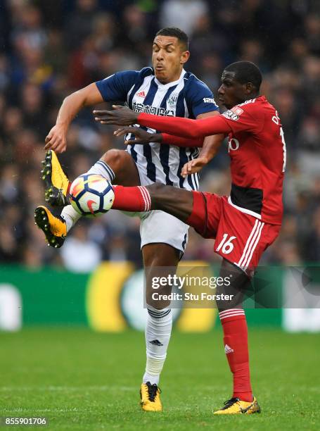 Jake Livermore of West Bromwich Albion and Abdoulaye Doucoure of Watford compete for the ball during the Premier League match between West Bromwich...