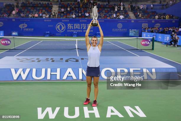 Caroline Garcia of France poses with her trophy after defeating Ashleigh Barty of Australia in the Finals match of Women's Single of 2017 Wuhan Open...