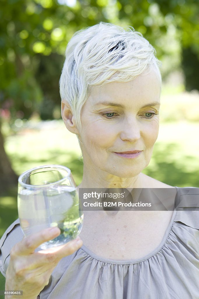Mature woman with a glass of water