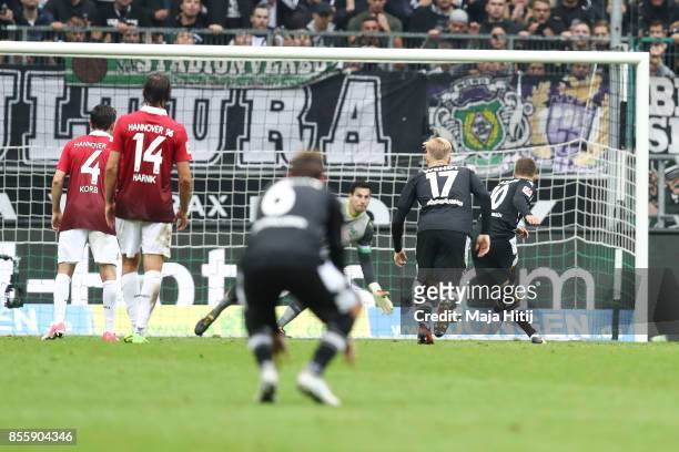 Thorgan Hazard of Moenchengladbach scores penalty shot to make it 2-1 during the Bundesliga match between Borussia Moenchengladbach and Hannover 96...