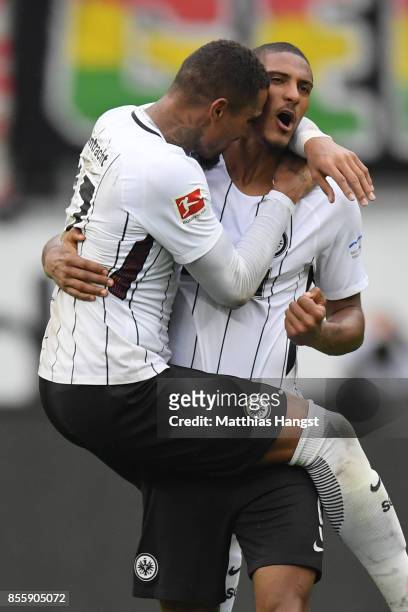 Sebastien Haller of Frankfurt celebrates with Kevin Prince-Boateng of Frankfurt after he scored the late winning goal to make it 2:1 during the...