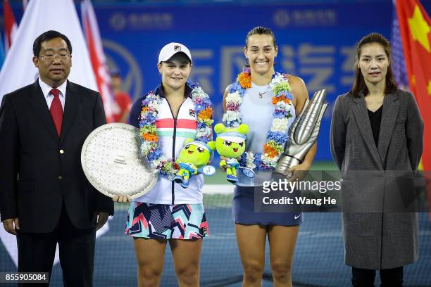 Caroline Garcia and Ashleigh Barty pose with the trophy at the award ceremony after the ladies singles final between Ashleigh Barty of Australia and...