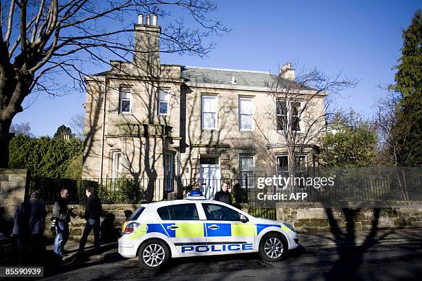 Police car is pictured outside a home of former Royal Bank of Scotland Chief Executive Sir Fred Goodwin, in Edinburgh, Scotland, on March 25, 2009....