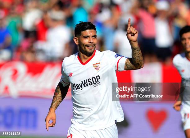 Sevilla's Argentinian midfielder Ever Banega celebrates after scoring a goal during the Spanish league football match Sevilla FC vs Malaga CF at the...