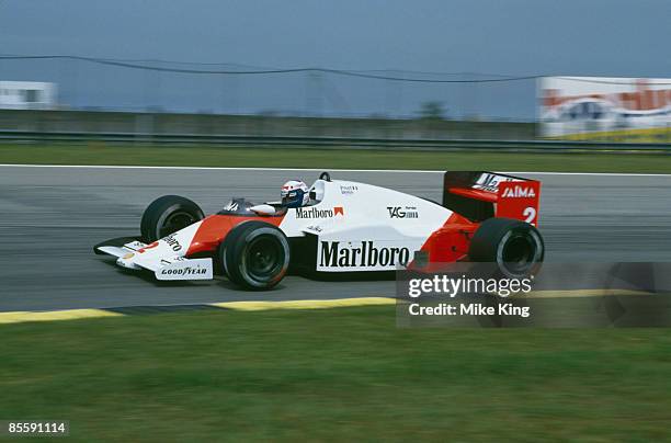 French racing driver Alain Prost driving a McLaren-TAG Porsche in the Brazilian Grand Prix, Rio de Janeiro, 7th April 1985. Prost went on to win the...