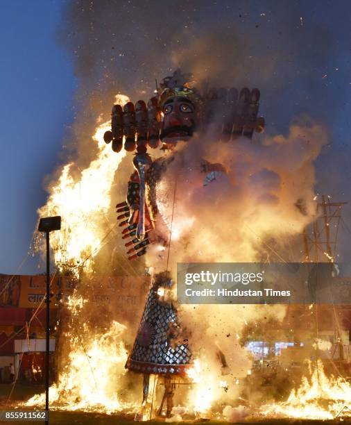 An effigy of Ravana burns during the Dussehra festival celebration organised by Shri Dharmik Leela Committee at Lal Quila Grounds, on September 30,...