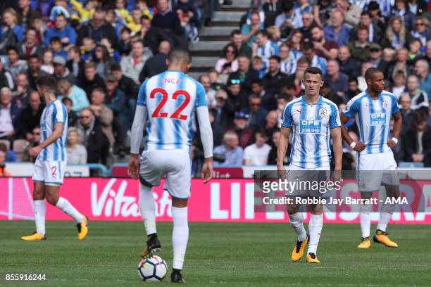 Dejected Huddersfield Town players during the Premier League match between Huddersfield Town and Tottenham Hotspur at John Smith's Stadium on...