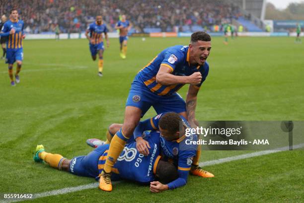 Carlton Morris of Shrewsbury Town celebrates with his team mates after scoring a goal to make it 2-0 during the Sky Bet League One match between...