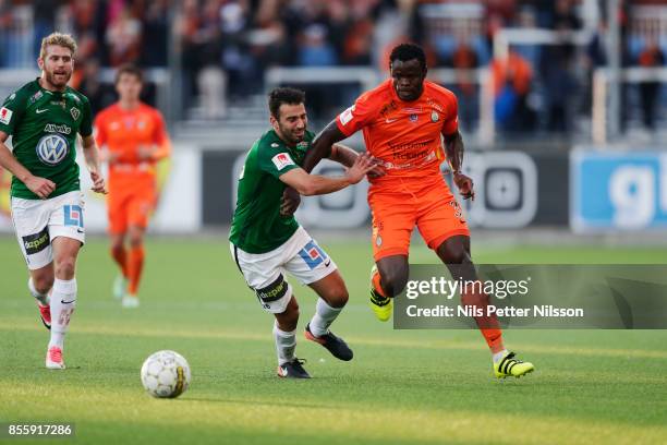 Andre Calisir of Jonkopings Sodra and Taye Taiwo of Athletic FC Eskilstuna competes for the ball during the Allsvenskan match between Athletic FC...