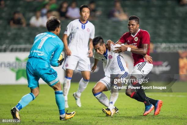 Awal Mahama of Hong Kong Pegasus fights for the ball with Chi Ho Lee of Eastern Long Lions during the week four Premier League match between Hong...