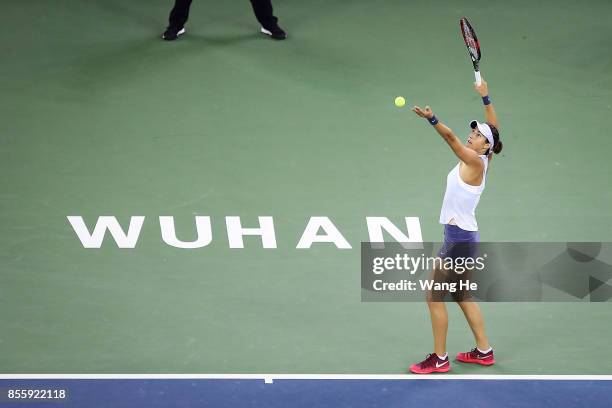 Caroline Garcia of France serves against Ashleigh Barty of Australia on Day 7 of 2017 Dongfeng Motor Wuhan Open at Optics Valley International Tennis...