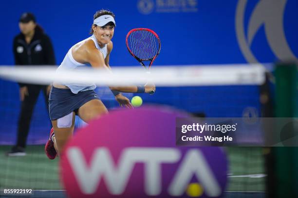 Caroline Garcia of France returns a shot during the Finals match against Ashleigh Barty of Australia on Day 7 of 2017 Dongfeng Motor Wuhan Open at...