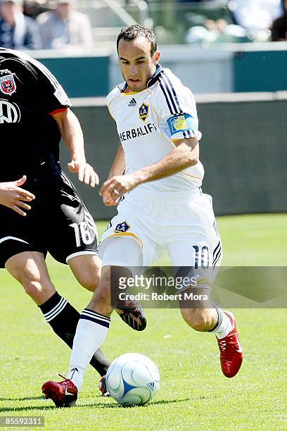Forward Landon Donovan of the Los Angeles Galaxy attacks the defense of D.C. United during the MLS game at Home Depot Center on March 22, 2009 in...