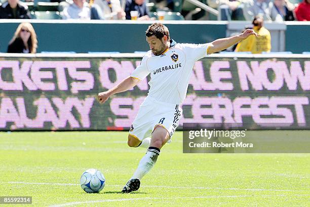 Dema Kovalenko of the Los Angeles Galaxy makes a pass up the field against the defense of D.C. United during the MLS game at Home Depot Center on...