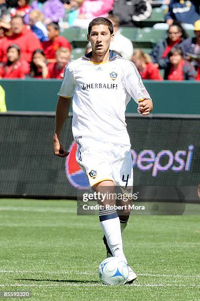 Omar Gonzalez of the Los Angeles Galaxy controls the ball against the defense of D.C. United during the MLS game at Home Depot Center on March 22,...