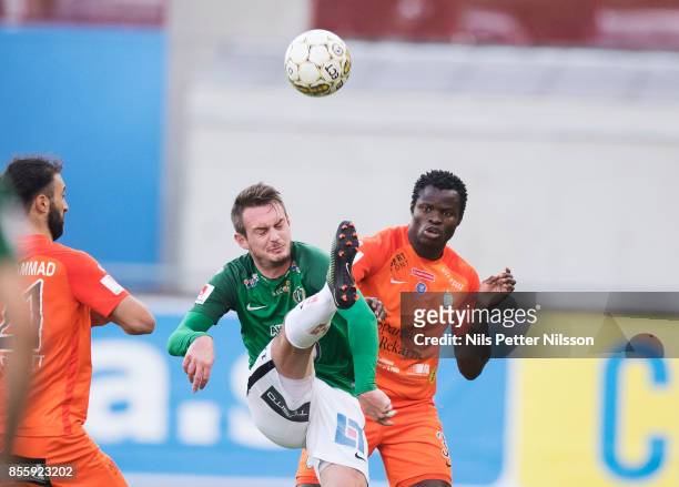 Daryl Smylie of Jonkopings Sodra and Taye Taiwo of Athletic FC Eskilstuna competes for the ball during the Allsvenskan match between Athletic FC...