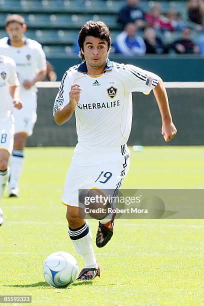 Josh Tudela of the Los Angeles Galaxy attacks the defense of D.C. United during the MLS game at Home Depot Center on March 22, 2009 in Carson,...