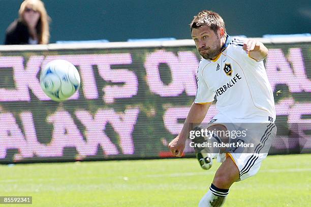 Dema Kovalenko of the Los Angeles Galaxy makes a pass up the field against the defense of D.C. United during the MLS game at Home Depot Center on...