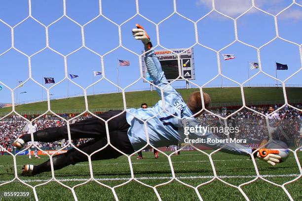 Josh Saunders of the Los Angeles Galaxy dives to stop a penalty kick during the MLS game against D.C. United at Home Depot Center on March 22, 2009...