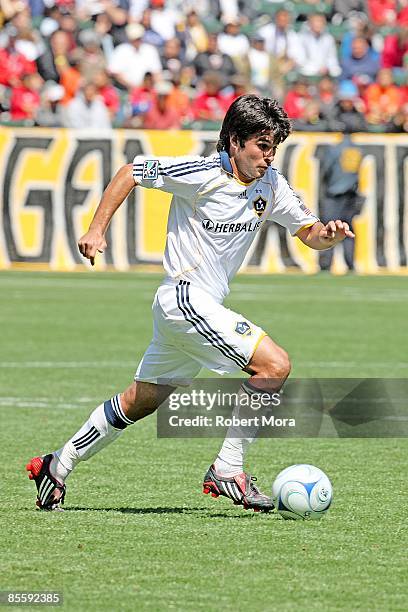 Josh Tudela of the Los Angeles Galaxy attacks the defense of D.C. United during the MLS game at Home Depot Center on March 22, 2009 in Carson,...
