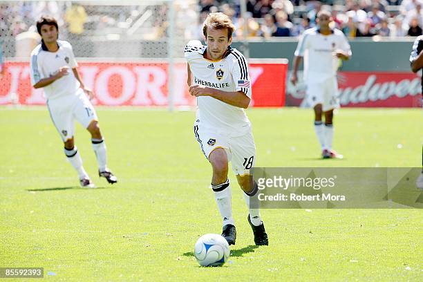 Mike Magee of the Los Angeles Galaxy attacks the defense of D.C. United during the MLS game at Home Depot Center on March 22, 2009 in Carson,...