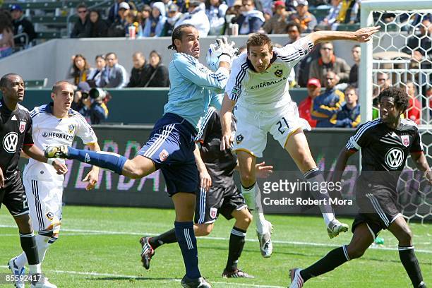 Josh Wicks of D.C. United saves a pass to forward Alan Gordon of the Los Angeles Galaxy during the MLS game at Home Depot Center on March 22, 2009 in...