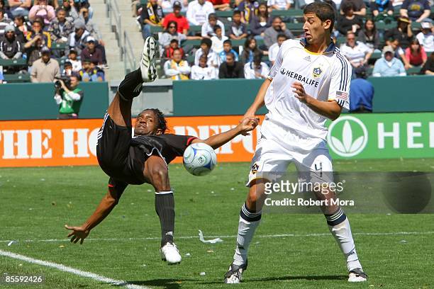 Luciano Emilio of D.C. United loses balance while trying to control the ball against Omar Gonzalez of the Los Angeles Galaxy during the MLS game at...