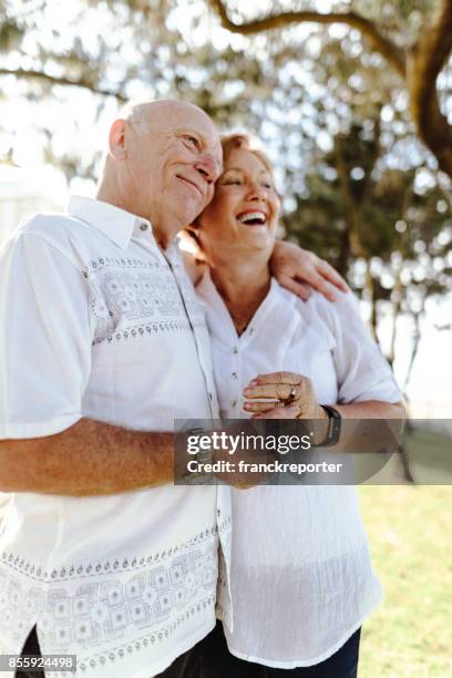 active seniors enjoy at the park in gold coast -australia - australasia stock pictures, royalty-free photos & images