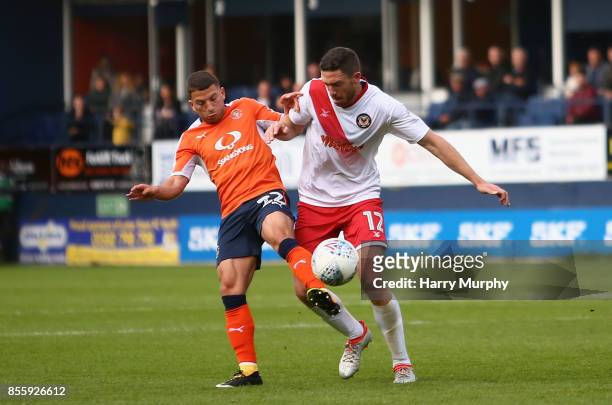 Luke Gambin of Luton Town and Ben Tozer of Newport County battle for possession during the Sky Bet League Two match between Luton Town and Newport...