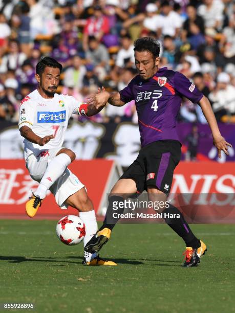 Marcus Tulio Tanaka of Kyoto Sanga and Yuto Sato of JEF United Chiba compete for the ball during the J.League J2 match between Kyoto Sanga and KEF...