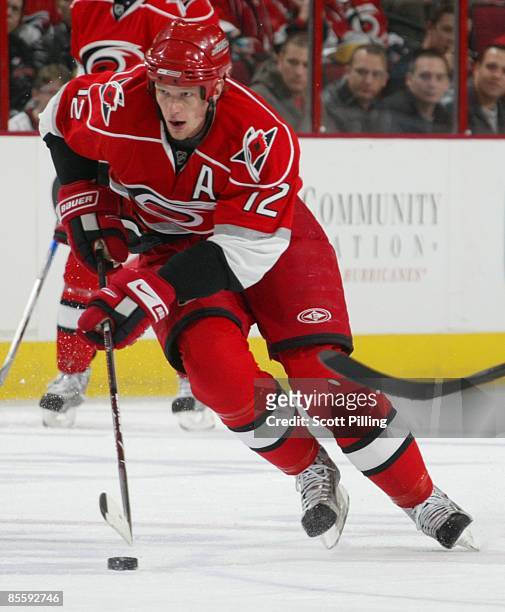 Eric Staal of the Carolina Hurricanes skates with the puck into the defensive zone the Tampa Bay Lightning during their NHL game on February 20, 2009...