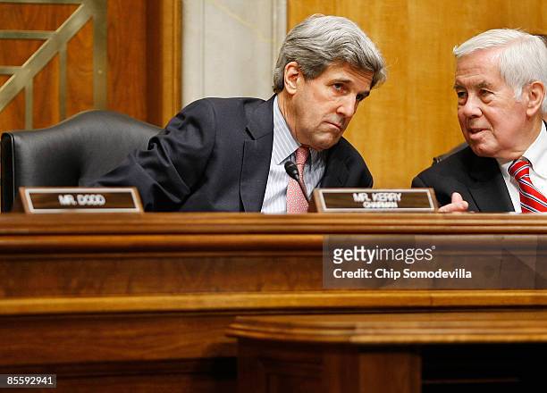 Senate Foreign Relations Committee Chairman John Kerry talks with ranking member Sen. Richard Lugar during the confirmation hearing for Christopher...