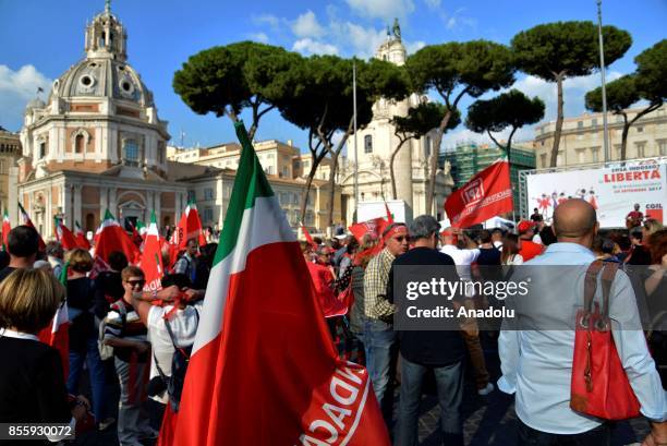 Men and women with flags of Italy gather to protest against gender-based violence in Rome, Italy on September 30, 2017.