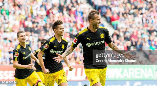 Andrey Yarmolenko of Borussia Dortmund cheers after scoring his team's 1th goal with Julian Weigl during the Bundesliga match between FC Augsburg and...