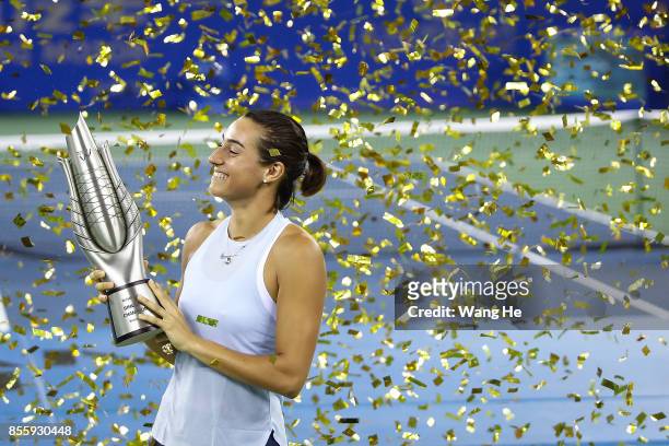 Caroline Garcia of France poses with her trophy after defeating Ashleigh Barty of Australia in the Finals match of Women's Single of 2017 Wuhan Open...